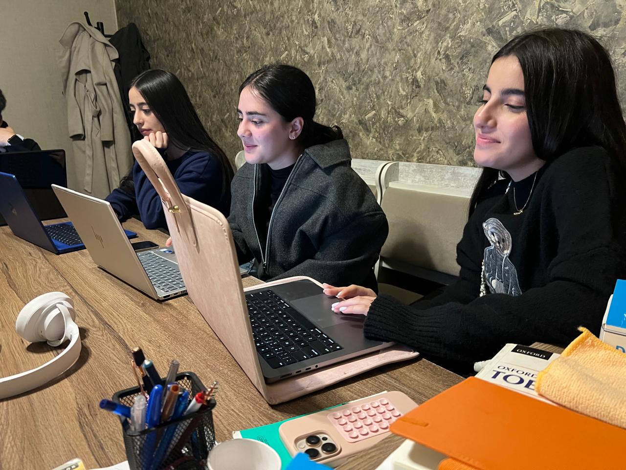 Calm late-evening prep group working on practice tests